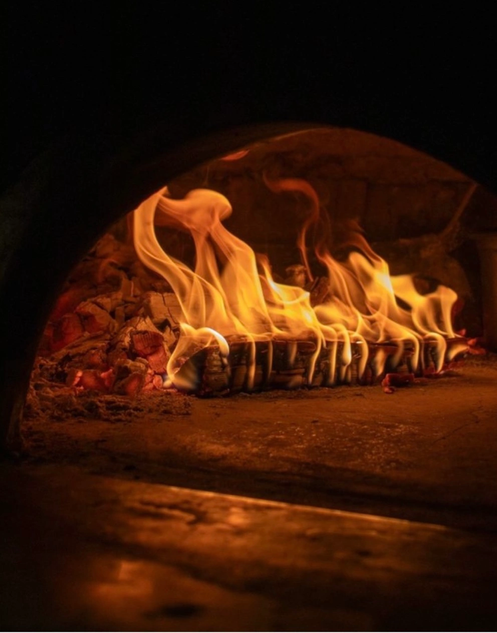 Flames burning inside the Bello wood-fired oven