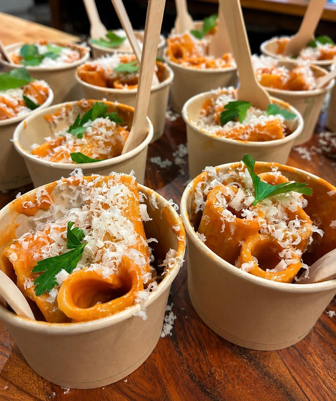 Vodka rigatoni served in individual cups with parmesan and parsley
